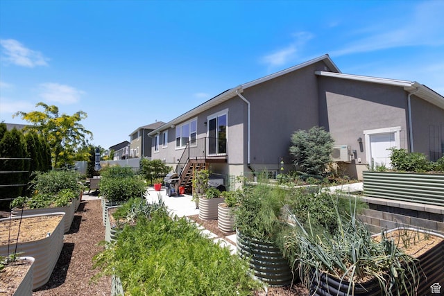 605 W 1660 S, Provo, UT 84601 - view of property exterior featuring a vegetable garden, stucco siding, and a residential view