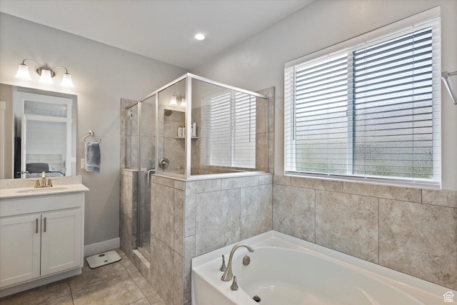 605 W 1660 S, Provo, UT 84601 - bathroom with vanity, a bath, a stall shower, and healthy amount of natural light