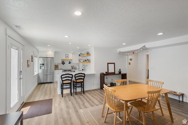 605 W 1660 S, Provo, UT 84601 - dining space featuring a textured ceiling, light wood-type flooring, and recessed lighting