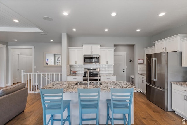 605 W 1660 S, Provo, UT 84601 - kitchen with appliances with stainless steel finishes, backsplash, white cabinetry, and recessed lighting