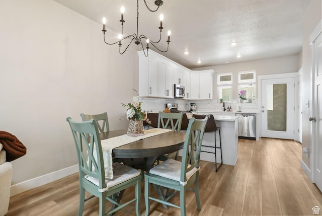 1017 S 2740 E, Spanish Fork, UT 84660 - dining area featuring light wood-style flooring, a chandelier, and recessed lighting