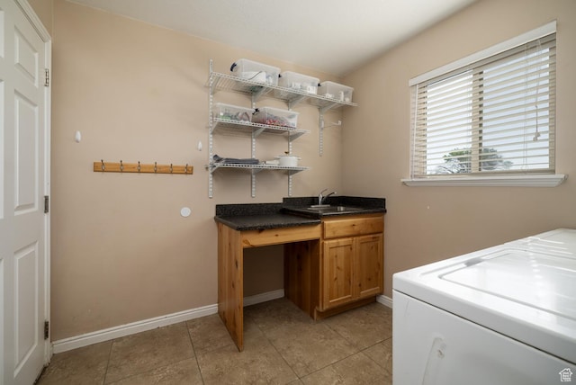 4145 W 700 N, Vernal, UT 84078 - washroom featuring washer / clothes dryer, light tile patterned floors, and cabinet space