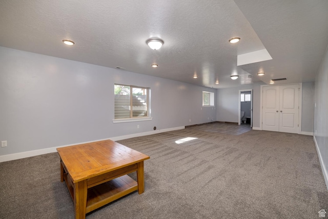 4145 W 700 N, Vernal, UT 84078 - unfurnished living room featuring carpet flooring, a textured ceiling, and recessed lighting