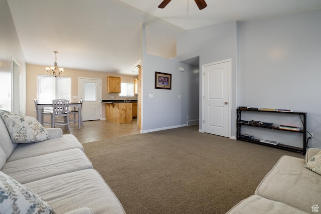 4145 W 700 N, Vernal, UT 84078 - living room with a ceiling fan, a chandelier, vaulted ceiling, light carpet, and light tile patterned floors