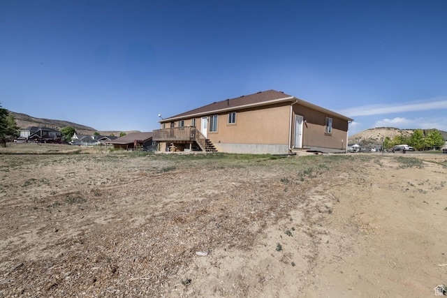 4145 W 700 N, Vernal, UT 84078 - back of house featuring stairway and a deck with mountain view