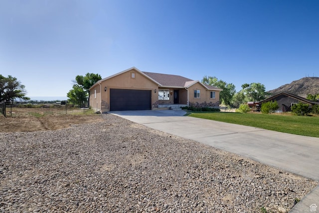 4145 W 700 N, Vernal, UT 84078 - ranch-style home with a garage, concrete driveway, and stucco siding