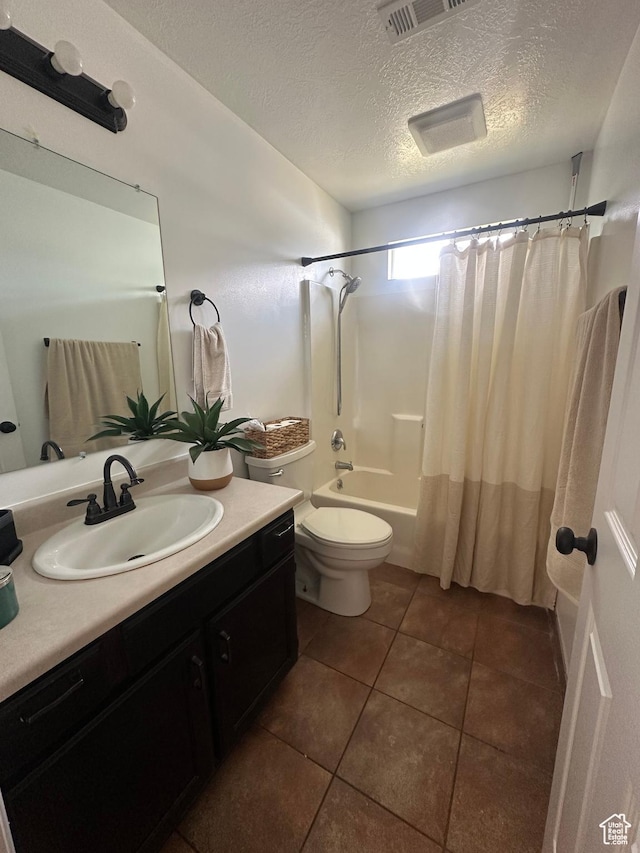 1485 N Monroe Blvd E, Ogden, UT 84404 - bathroom with vanity, a textured ceiling, shower / bath combination with curtain, and tile patterned flooring