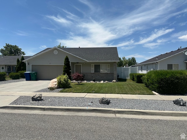 1485 N Monroe Blvd E, Ogden, UT 84404 - ranch-style house featuring brick siding, concrete driveway, and a garage