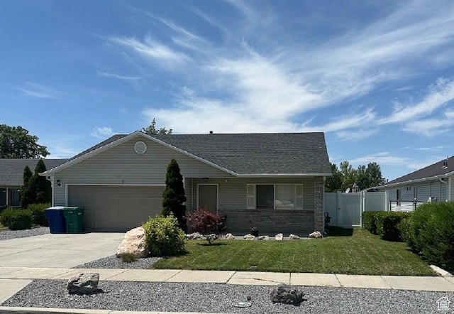 1485 N Monroe Blvd E, Ogden, UT 84404 - single story home with driveway, an attached garage, and brick siding
