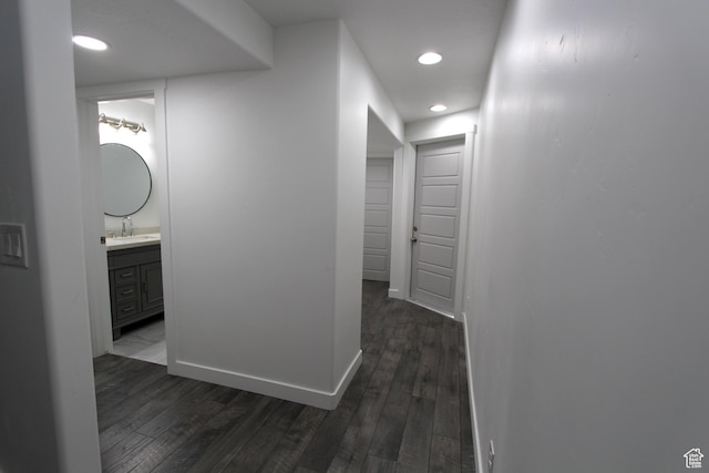 6255 N Wanlass Hl, Eagle Mountain, UT 84005 - hallway featuring dark wood-style flooring and recessed lighting
