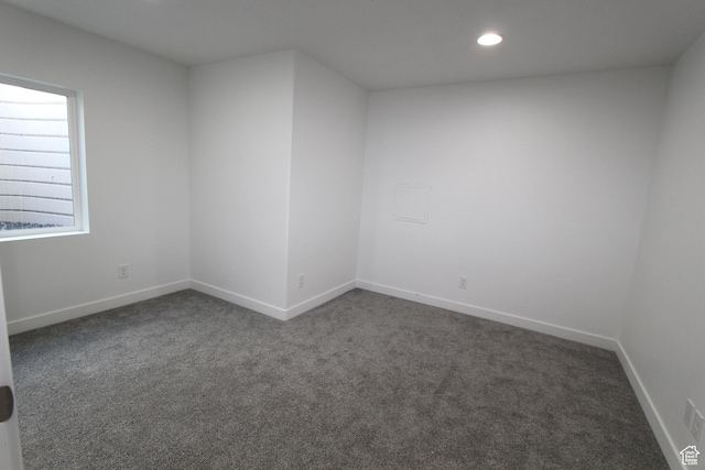 6255 N Wanlass Hl, Eagle Mountain, UT 84005 - spare room with dark colored carpet and recessed lighting