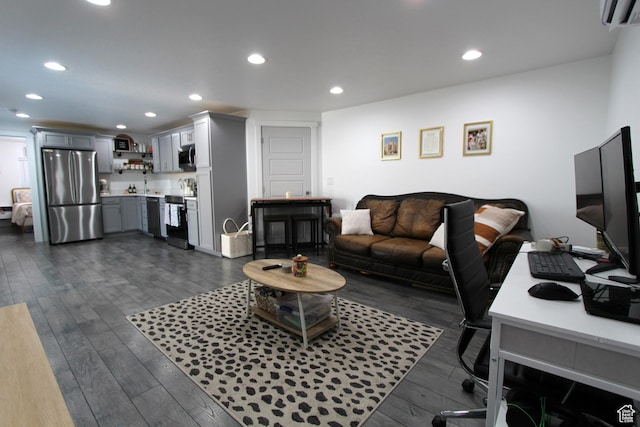 6255 N Wanlass Hl, Eagle Mountain, UT 84005 - living area featuring a wall mounted air conditioner, dark wood-style flooring, and recessed lighting