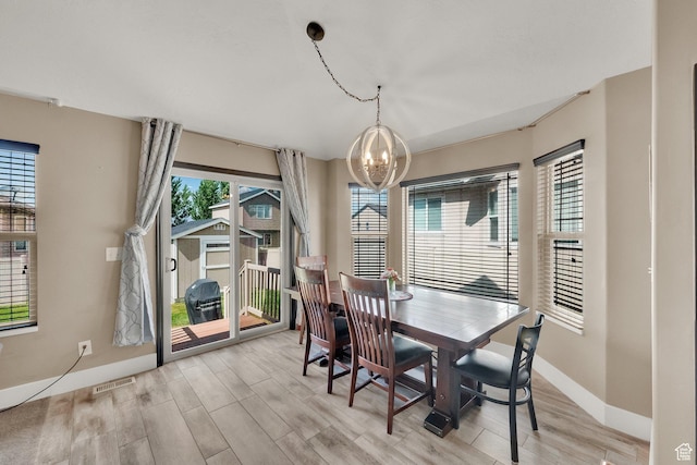 3424 W 4450 S, West Haven, UT 84401 - dining room featuring a chandelier and light wood-style flooring