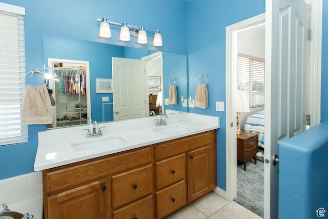 6628 N Malachite Way, Stansbury Park, UT 84074 - bathroom with connected bathroom, double vanity, and tile patterned flooring