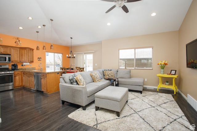 6628 N Malachite Way, Stansbury Park, UT 84074 - living room with dark wood finished floors, a ceiling fan, recessed lighting, and a chandelier