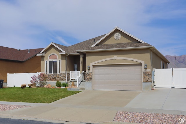 6628 N Malachite Way, Stansbury Park, UT 84074 - ranch-style home with stone siding, stucco siding, concrete driveway, a gate, and a garage