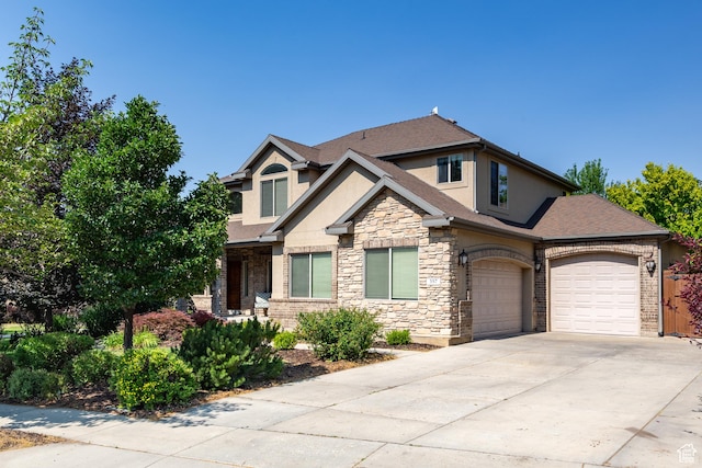 357 N Main St, Alpine, UT 84004 - craftsman inspired home with stucco siding, stone siding, an attached garage, concrete driveway, and roof with shingles