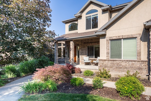 357 N Main St, Alpine, UT 84004 - traditional-style home with a porch, stucco siding, and brick siding