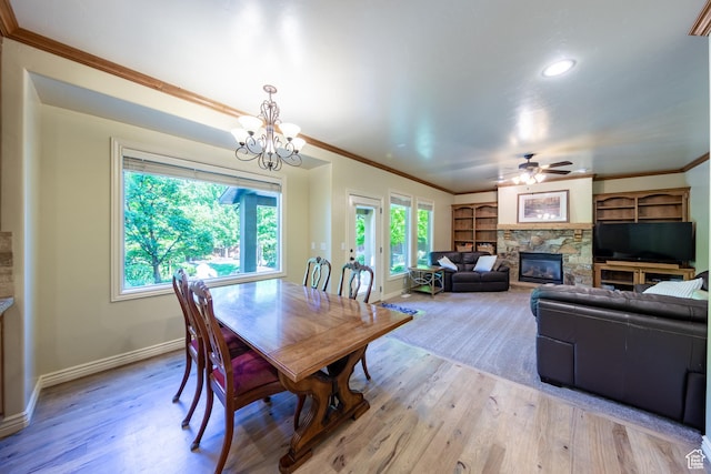 357 N Main St, Alpine, UT 84004 - dining area with plenty of natural light, crown molding, a fireplace, light wood-style flooring, and recessed lighting