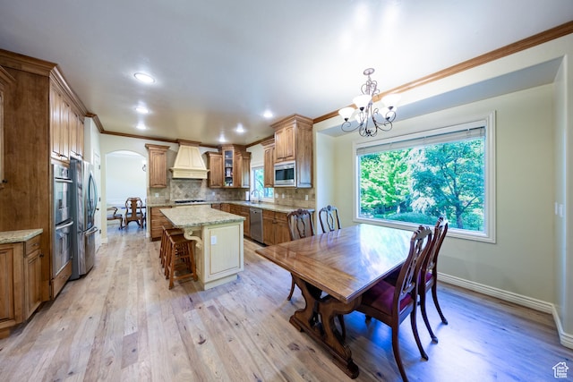 357 N Main St, Alpine, UT 84004 - dining room with arched walkways, a chandelier, ornamental molding, light wood finished floors, and recessed lighting