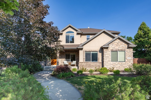 357 N Main St, Alpine, UT 84004 - view of front of house featuring stucco siding, a porch, and stone siding