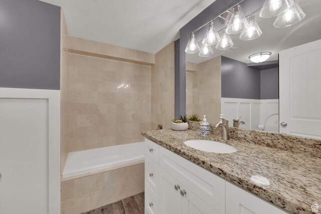 563 S 1850 E, Spanish Fork, UT 84660 - full bath with vanity, tiled shower / bath, and wood finished floors