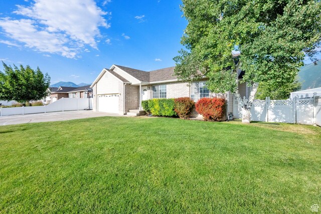 563 S 1850 E, Spanish Fork, UT 84660 - ranch-style house with brick siding, driveway, and a garage