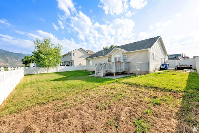 563 S 1850 E, Spanish Fork, UT 84660 - back of property with a deck and a fenced backyard