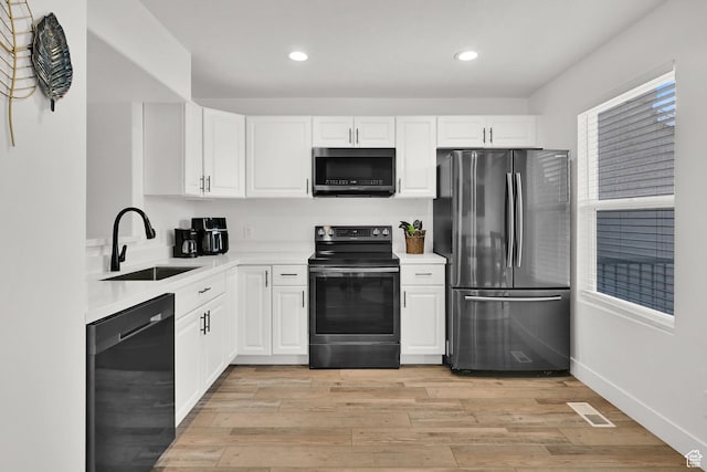 371 E Braidhill Dr, Draper, UT 84020 - kitchen with appliances with stainless steel finishes, light countertops, white cabinetry, light wood-type flooring, and recessed lighting
