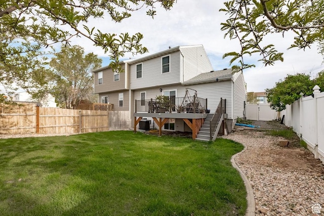208 Alfred Dr, Tooele, UT 84074 - rear view of house featuring stairway, a wooden deck, and a fenced backyard