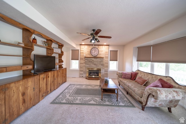 190 E 600 N, Ferron, UT 84523 - carpeted living room with a ceiling fan, plenty of natural light, and a brick fireplace