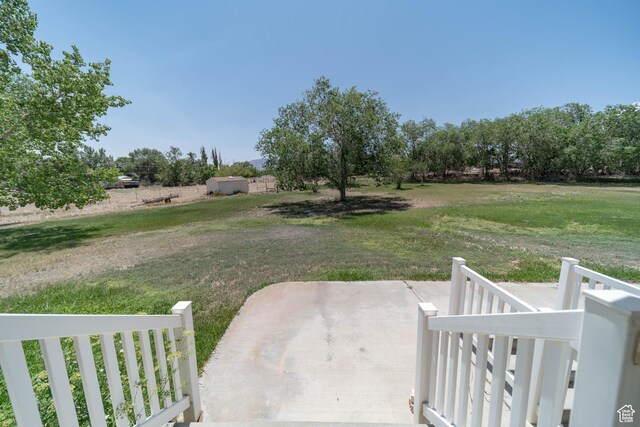 190 E 600 N, Ferron, UT 84523 - view of grassy yard featuring a patio and a view of countryside
