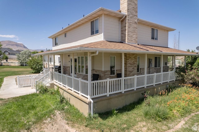 190 E 600 N, Ferron, UT 84523 - back of house with a porch, a chimney, and a shingled roof