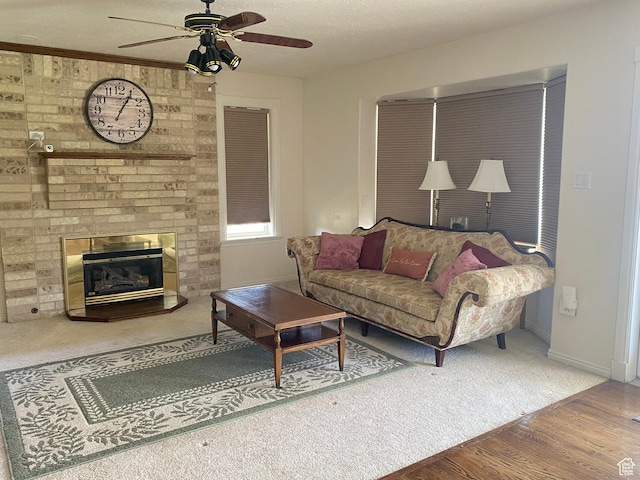 190 E 600 N, Ferron, UT 84523 - carpeted living area featuring ceiling fan, wood finished floors, and a brick fireplace