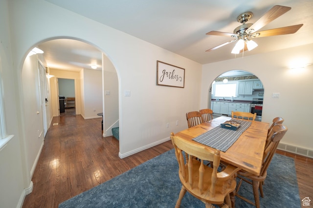 190 E 600 N, Ferron, UT 84523 - dining space with arched walkways, wood finished floors, ceiling fan, and stairway