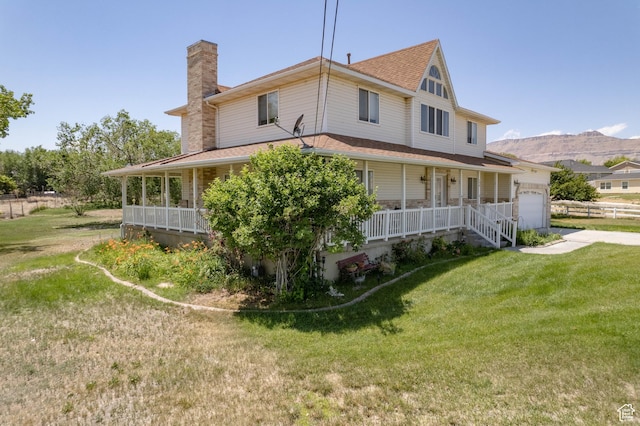 190 E 600 N, Ferron, UT 84523 - view of side of home featuring a porch, a chimney, a garage, a lawn, and roof with shingles