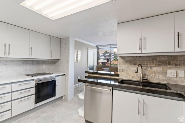241 N Vine St Unit 506W, Salt Lake City, UT 84103 - kitchen with stainless steel appliances, backsplash, light marble finish floors, ornamental molding, and white cabinetry