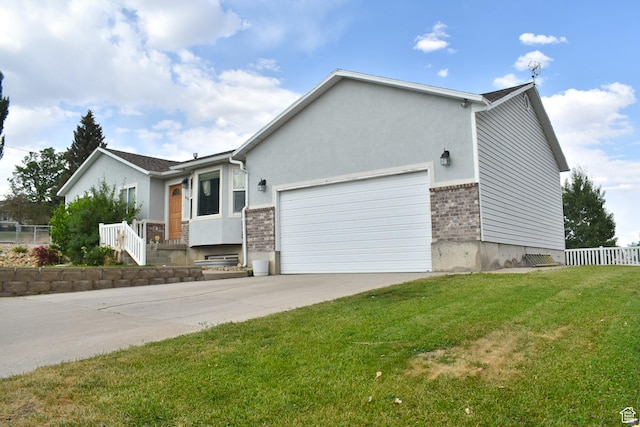 480 N 550 W, Huntington, UT 84528 - view of front of house with a garage, driveway, stucco siding, and brick siding