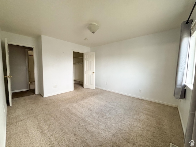 480 N 550 W, Huntington, UT 84528 - unfurnished bedroom featuring carpet floors, a closet, and a spacious closet