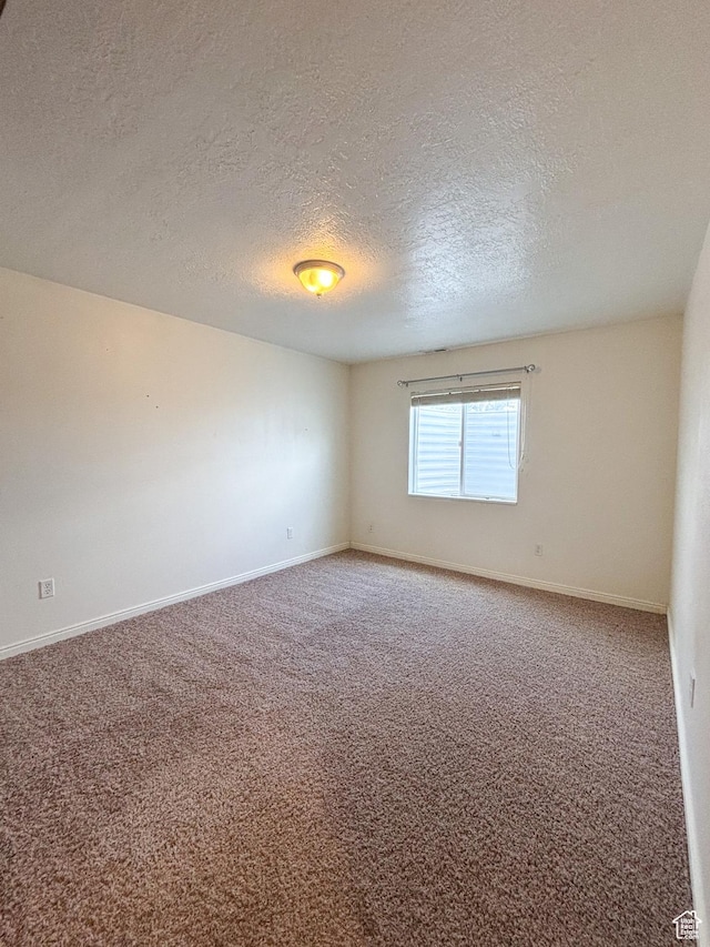 480 N 550 W, Huntington, UT 84528 - carpeted spare room featuring a textured ceiling