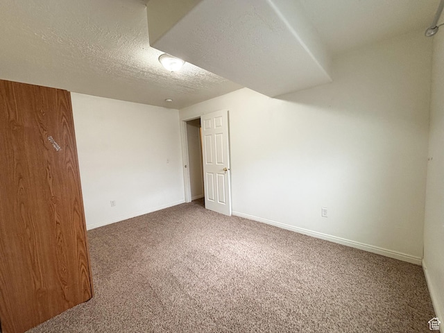 480 N 550 W, Huntington, UT 84528 - carpeted empty room featuring a textured ceiling and baseboards