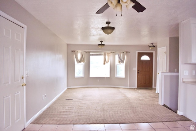 480 N 550 W, Huntington, UT 84528 - entryway featuring light carpet, a ceiling fan, and light tile patterned floors