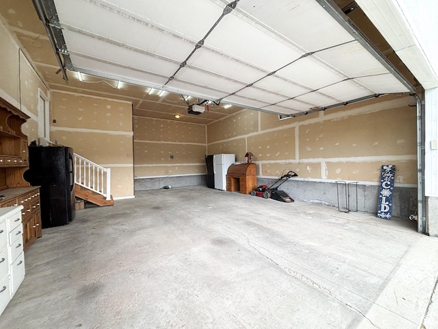 480 N 550 W, Huntington, UT 84528 - garage featuring a garage door opener and freestanding refrigerator