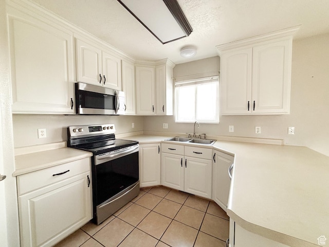 480 N 550 W, Huntington, UT 84528 - kitchen featuring appliances with stainless steel finishes, light tile patterned floors, white cabinetry, and light countertops