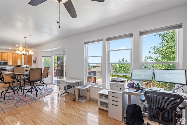 1721 E Lone Oak Dr, Draper, UT 84020 - office area with a chandelier, light wood-style flooring, and a ceiling fan