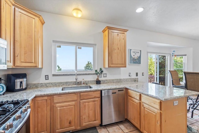 1721 E Lone Oak Dr, Draper, UT 84020 - kitchen with stainless steel appliances, a peninsula, light stone counters, light tile patterned flooring, and light brown cabinetry