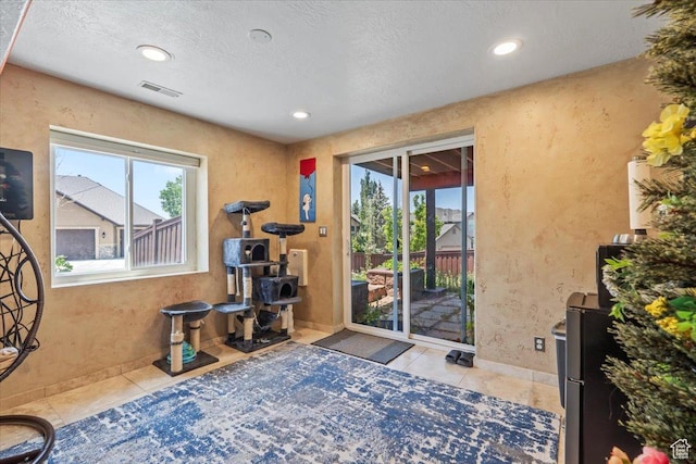 1721 E Lone Oak Dr, Draper, UT 84020 - exercise area featuring tile patterned flooring, recessed lighting, and a textured ceiling