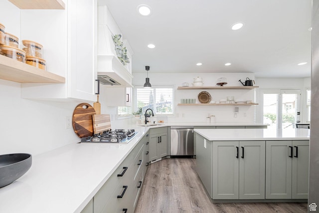 2524 W Martingale Cir S, South Jordan, UT 84095 - kitchen with stainless steel appliances, open shelves, light countertops, light wood-style floors, and gray cabinetry