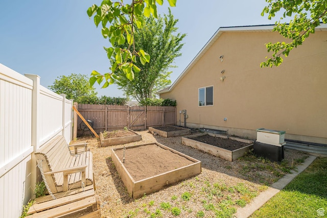 2524 W Martingale Cir S, South Jordan, UT 84095 - fenced backyard featuring a garden