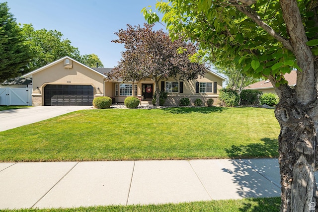 2524 W Martingale Cir S, South Jordan, UT 84095 - view of front facade featuring a gate, an attached garage, driveway, and stucco siding